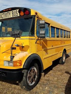 a yellow school bus parked in a field