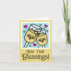 a card that says new year blessing with two cats holding glasses in front of them