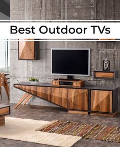 a living room with a large tv and wooden furniture on the wall next to a rug