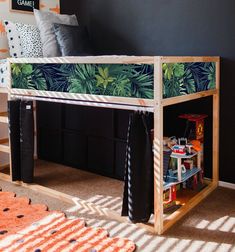 a bunk bed with tropical print on the top and bottom part, in a child's bedroom