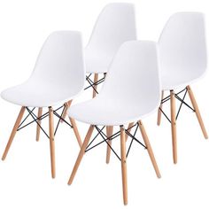 three white chairs with wooden legs