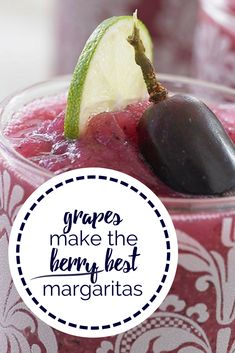 a close up of a drink in a glass with an avocado on top