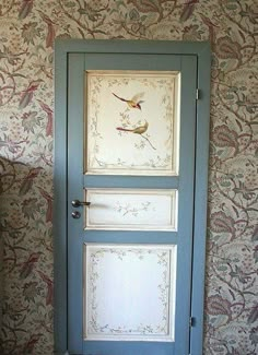 an open door in a room with floral wallpaper