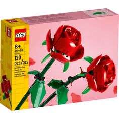 a lego box with two red roses in it