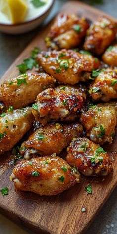 chicken wings with parsley on a cutting board