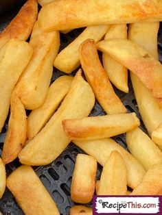 french fries are being cooked on the grill