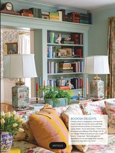 a living room filled with furniture and lots of books