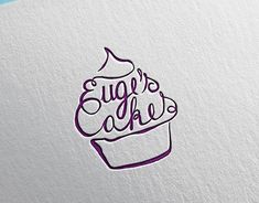 a cupcake with the words sugar's cake written on it is shown in purple ink