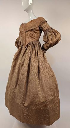 1830’S GOLDEN FIGURED SILK DRESS W FAN FRONT & GIGOT SLEEVES | eBay Elegant Fitted Prairie Dress With Gathered Sleeves, Elegant Historical Dress For Vintage Events, Elegant Dress With Historical Design For Vintage Events, Victorian Formal Dresses For Fall, Fitted Gold Dress For Costume, Elegant Fitted Gold Victorian Dress, Vintage Gold Dress With Historical Design, Regency Style Gold Dress With Historical Design, Vintage Gold Dresses With Historical Design