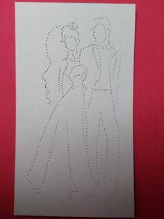 a piece of paper that has been cut into two people