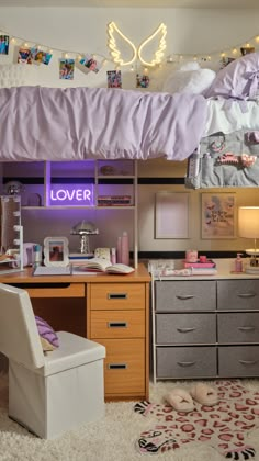 a bedroom with a loft bed, desk and chair under the cover that reads lover