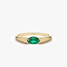 "Emerald Ring / 14k Gold Marquise Shape Natural Emerald Ring / Horizontal Set Marquise Genuine Emerald Ring by Ferkos Fine jewelry / May Birthstone *Made to Order *Gold Kt: 14K (also available in 18K) *Available Gold Color: Rose Gold, Yellow Gold, White Gold *Marquise Shape Emerald: 1 pc 6 x 3 MM *Emerald Carat Weight: 0.25 ctw * Ready to Ship in 7-10 Business Days If you have any additional questions about this ring, just hit the \"Message Ferko\" button and we will get back to you within a few Yellow Gold Marquise Emerald Ring, Marquise Emerald Ring In Yellow Gold, Heirloom Marquise Emerald Ring In 14k Gold, Heirloom Solitaire Emerald Ring, Marquise Emerald Yellow Gold Jewelry, Modern Emerald Jewelry With Center Stone, Heirloom Emerald Marquise Rings, Fine Jewelry Marquise Emerald Ring With 17 Jewels, Elegant 14k Gold Turquoise Promise Ring