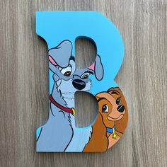 the letter b is painted to look like lady and the tramp