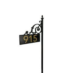 a black and gold street sign with the number 915 on it's side