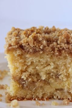 a close up of a piece of cake on a plate with some crumbs