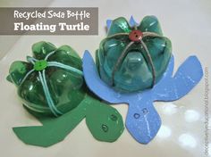 two green plastic turtle ornaments sitting on top of a white table next to each other