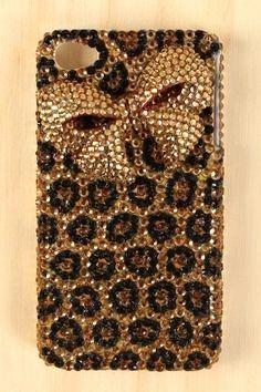 a cell phone case with a bow on the front and leopard print on the back