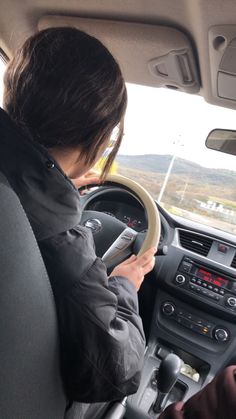 a person driving a car on the road