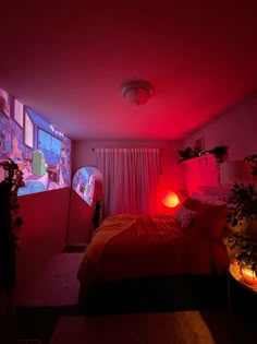 a bed room with a neatly made bed and red lights