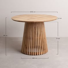 a wooden table sitting on top of a cement floor