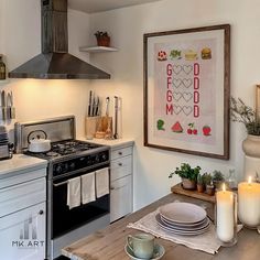 the kitchen is clean and ready to be used for cooking or baking, with candles on the counter