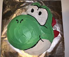 a cake that is shaped like an angry broccoli on top of tin foil