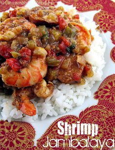 shrimp and vegetable stew on top of white rice with red paisley design around the edges