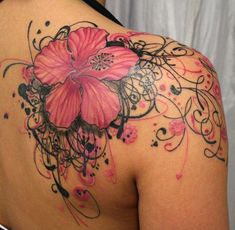 a woman's back with pink flowers and swirls on it