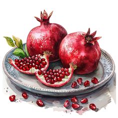 two pomegranates on a plate with leaves