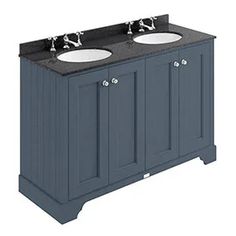 a double sink vanity with two white sinks