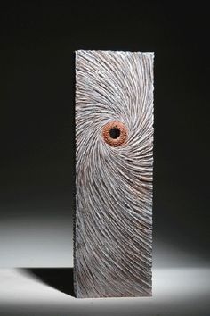 a sculpture with an eye in it's center