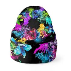 a beanie hat with colorful flowers and butterflies on the front, sitting against a white background