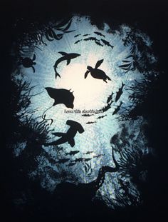 silhouettes of birds flying in the night sky