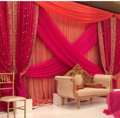 a room decorated in pink and gold colors