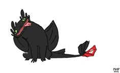 a black cat with green eyes sitting on the ground next to a red object in its paws