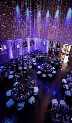 an overhead view of a banquet room with purple lighting