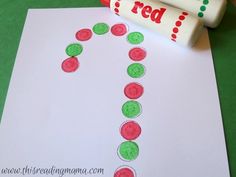 a paper with the word red on it and some crayons next to it