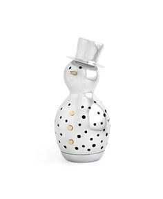 a white vase with polka dots and a top hat