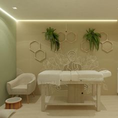 a spa room with white towels and plants on the wall, in front of two massage tables