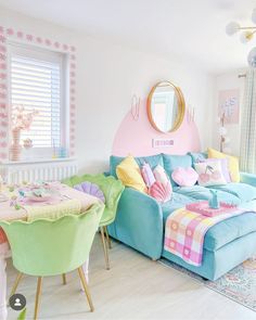 a living room filled with lots of furniture and colorful decor on top of wooden floors