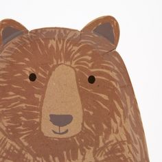 a paper cut out of a brown bear