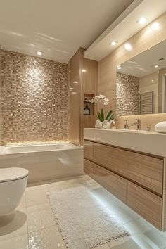 a bathroom with a tub, toilet and sink in it's centerpieces