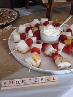 strawberries and marshmallows on skewers with dip