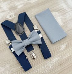 Your special guy will look so handsome when he shows up in his Dusty Blue bow tie, pocket square and Navy Blue suspenders!  Great set for groomsman, best man or ring bearers - This bow tie & suspenders set is a great choice for family photos, wedding, ring bearer outfit, birthday celebration or any other special occasion.  When making a purchase, you can choose from the following options : -Suspenders Only -Bow Tie Only. -Suspenders + Bow Tie Set. - Pocket Square only. -3 Pieces Set : bow tie + Blue Bow Tie For Wedding And Father's Day, Dapper Blue Bow Tie For Groom, Blue Groom Suit Accessories With Pocket Square, Navy Blue Braces, Dusty Blue Bow Tie, Blue Braces, Navy Blue Suspenders, Blue Suspenders, Outfit Boho