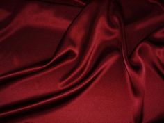 a red silk background with some folds