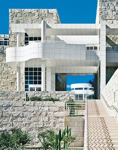 a white building with stairs leading up to it