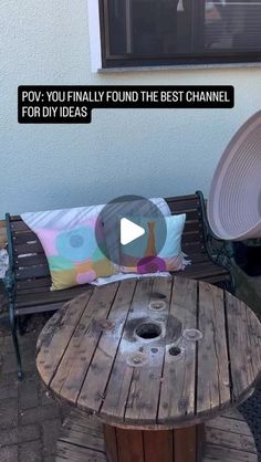 a wooden table sitting on top of a patio next to a chair and umbrella with the caption pov - you really found the best channel for diy ideas