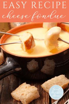 a bowl filled with cheese fondant next to crackers