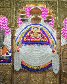 an elaborately decorated bed in the middle of a room