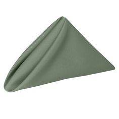 a green napkin folded in the shape of a triangle